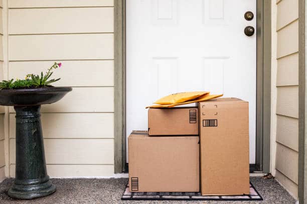 Multiple different packages sitting on the front porch