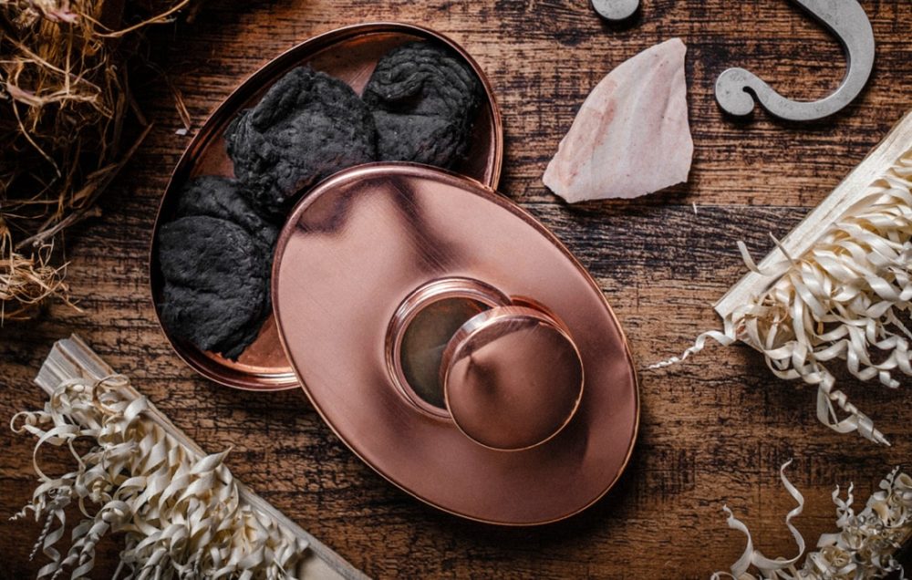 Garrett Wade copper pot with meat on wood table