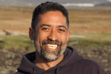 Alan Emtage Headshot _ black history month black innovator _ Alan smiling in a hoodie outside